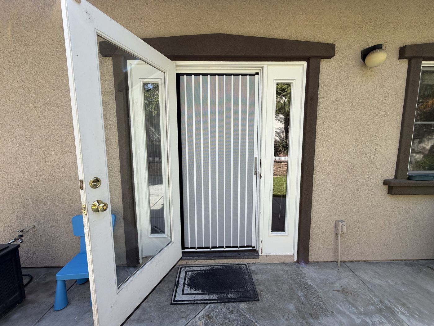 White folding screen on a single door with glass sidelights